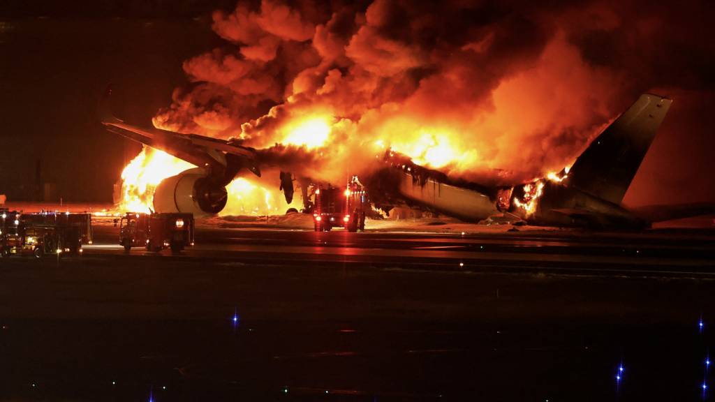 Japan Airlines plane bursts into flames with 379 people on board, all escape